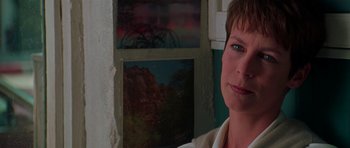 Movie still from “Halloween H20: 20 Years Later” (1998), directed by Steve Miner – A person in front of a painting; Close Up shot, Over the shoulder angle