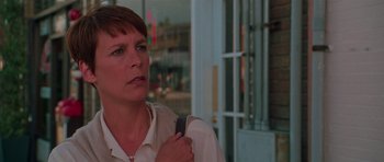 Movie still from “Halloween H20: 20 Years Later” (1998), directed by Steve Miner – A person holding a cell phone; Close Up shot, Low angle