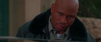 Movie still from “Halloween H20: 20 Years Later” (1998), directed by Steve Miner – A man with a bald head looking at the camera; Close Up shot, Low angle