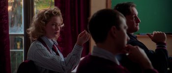 Movie still from “Halloween H20: 20 Years Later” (1998), directed by Steve Miner – A woman in a striped shirt and a red tie; Medium shot, Over the shoulder angle