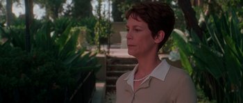 Movie still from “Halloween H20: 20 Years Later” (1998), directed by Steve Miner – A person wearing a necklace; Close Up shot, Over the shoulder angle