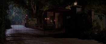 Movie still from “Halloween H20: 20 Years Later” (1998), directed by Steve Miner – A house that has a fence around it; Extreme Wide shot, Low angle
