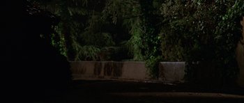 Movie still from “Halloween H20: 20 Years Later” (1998), directed by Steve Miner – A concrete wall in the middle of the night; Wide shot, Low angle
