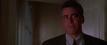 Movie still from “Halloween H20: 20 Years Later” (1998), directed by Steve Miner – A person wearing a suit and tie; Close Up shot, Low angle