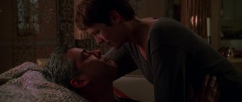 Movie still from “Halloween H20: 20 Years Later” (1998), directed by Steve Miner – A man and a woman laying on a bed together; Close Up shot, Low angle