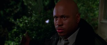 Movie still from “Halloween H20: 20 Years Later” (1998), directed by Steve Miner – A man with a bald head is looking at the camera; Close Up shot, Low angle