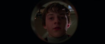 Movie still from “Halloween H20: 20 Years Later” (1998), directed by Steve Miner – A young man looking through a lens at the camera; Close Up shot, Low angle