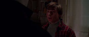Movie still from “Halloween H20: 20 Years Later” (1998), directed by Steve Miner – A young man in a red and black plaid shirt; Close Up shot, Over the shoulder angle