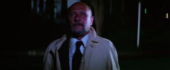 Movie still from “Halloween II” (1981), directed by Rick Rosenthal – A man wearing a white shirt and a white tie; Close Up shot, Low angle