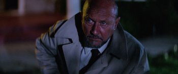 Movie still from “Halloween II” (1981), directed by Rick Rosenthal – A man with a beard and a jacket and a tie; Close Up shot, Low angle