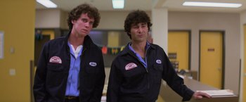 Movie still from “Halloween II” (1981), directed by Rick Rosenthal – A couple of men standing next to each other; Medium shot, Low angle