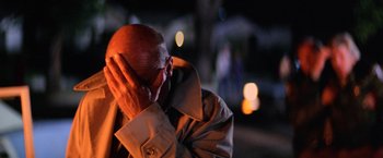 Movie still from “Halloween II” (1981), directed by Rick Rosenthal – An older man holding his head in his hands; Close Up shot, Over the shoulder angle