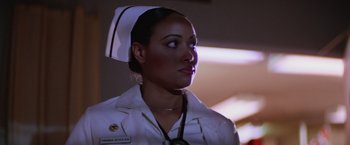 Movie still from “Halloween II” (1981), directed by Rick Rosenthal – A woman in a nurse's uniform with a stethoscope around her neck; Close Up shot, Low angle