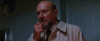 Movie still from “Halloween II” (1981), directed by Rick Rosenthal – An older man with a beard and a tie; Close Up shot, Low angle