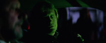 Movie still from “Halloween II” (1981), directed by Rick Rosenthal – A man in a dark room lit up by a green light; Close Up shot, Low angle