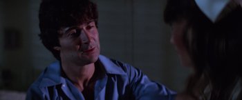 Movie still from “Halloween II” (1981), directed by Rick Rosenthal – A person wearing a blue shirt; Close Up shot, Over the shoulder angle