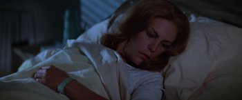 Movie still from “Halloween II” (1981), directed by Rick Rosenthal – A woman is laying in a bed with a blanket; Close Up shot, High angle