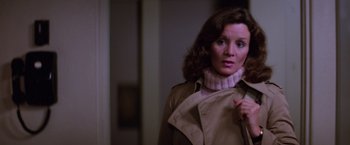 Movie still from “Halloween II” (1981), directed by Rick Rosenthal – A person wearing a coat; Close Up shot, Over the shoulder angle