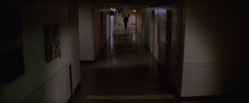 Movie still from “Halloween II” (1981), directed by Rick Rosenthal – A person walking down a long hallway in a building; Extreme Wide shot, High angle
