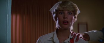 Movie still from “Halloween II” (1981), directed by Rick Rosenthal – A woman with blonde hair wearing a nurse's uniform; Close Up shot, Low angle