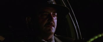 Movie still from “Halloween II” (1981), directed by Rick Rosenthal – A person wearing a uniform; Close Up shot, Low angle