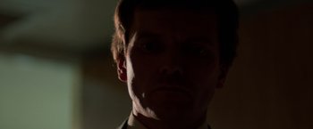 Movie still from “Halloween III: Season of the Witch” (1982), directed by Tommy Lee Wallace – A man's face in the dark; Close Up shot, Low angle