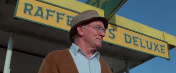 Movie still from “Halloween III: Season of the Witch” (1982), directed by Tommy Lee Wallace – An older man wearing glasses and a hat; Close Up shot, Low angle