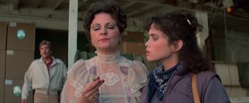 Movie still from “Halloween III: Season of the Witch” (1982), directed by Tommy Lee Wallace – A woman and a girl are standing next to each other; Close Up shot, Over the shoulder angle