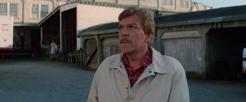 Movie still from “Halloween III: Season of the Witch” (1982), directed by Tommy Lee Wallace – A person wearing a jacket; Close Up shot, Low angle