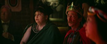 Movie still from “Halloween Kills” (2021), directed by David Gordon Green – A man and a woman sitting next to each other wearing crowns; Close Up shot, Low angle