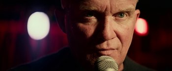 Movie still from “Halloween Kills” (2021), directed by David Gordon Green – A person holding a microphone; Extreme Close Up shot, Low angle