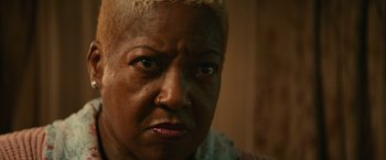 Movie still from “Halloween Kills” (2021), directed by David Gordon Green – An older woman with short blonde hair looking at the camera; Close Up shot, Low angle