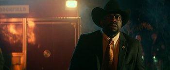 Movie still from “Halloween Kills” (2021), directed by David Gordon Green – A man in a suit and a cowboy hat; Close Up shot, Low angle