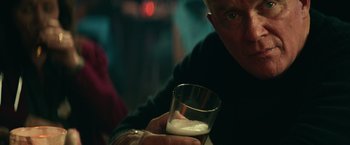 Movie still from “Halloween Kills” (2021), directed by David Gordon Green – An older man is holding a glass of milk; Close Up shot, Low angle