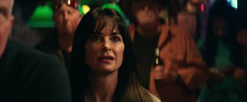 Movie still from “Halloween Kills” (2021), directed by David Gordon Green – A person with long black hair; Close Up shot, Over the shoulder angle