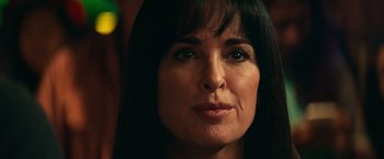 Movie still from “Halloween Kills” (2021), directed by David Gordon Green – A woman's face with long black hair; Close Up shot, Over the shoulder angle