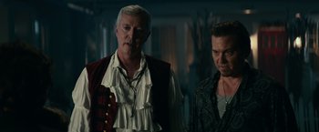 Movie still from “Halloween Kills” (2021), directed by David Gordon Green – A man and a man standing next to each other; Medium shot, Over the shoulder angle