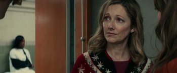 Movie still from “Halloween Kills” (2021), directed by David Gordon Green – A person wearing a sweater; Close Up shot, Over the shoulder angle