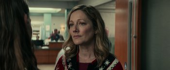 Movie still from “Halloween Kills” (2021), directed by David Gordon Green – A person wearing a sweater; Close Up shot, Over the shoulder angle