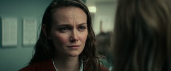 Movie still from “Halloween Kills” (2021), directed by David Gordon Green – A person with long brown hair; Close Up shot, Over the shoulder angle