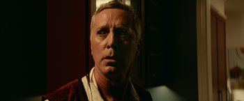 Movie still from “Halloween Kills” (2021), directed by David Gordon Green – A person wearing a shirt; Close Up shot, Low angle