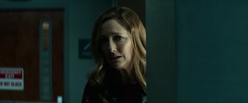 Movie still from “Halloween Kills” (2021), directed by David Gordon Green – A person with long blonde hair; Close Up shot, Over the shoulder angle