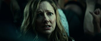 Movie still from “Halloween Kills” (2021), directed by David Gordon Green – A person with long blonde hair; Close Up shot, Over the shoulder angle