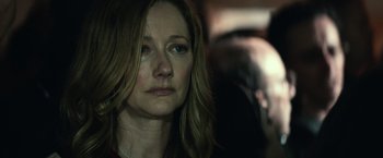 Movie still from “Halloween Kills” (2021), directed by David Gordon Green – A person wearing a red shirt; Close Up shot, Over the shoulder angle