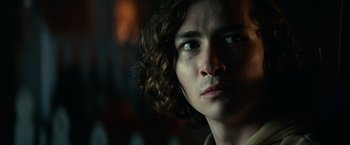 Movie still from “Halloween Kills” (2021), directed by David Gordon Green – A person with curly brown hair; Close Up shot, Low angle