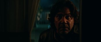 Movie still from “Halloween Kills” (2021), directed by David Gordon Green – A person looking at the camera; Close Up shot, Low angle