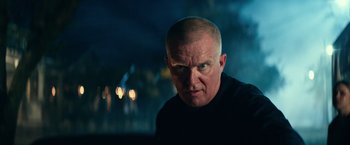 Movie still from “Halloween Kills” (2021), directed by David Gordon Green – A man with a shaved head is looking at the camera; Close Up shot, Low angle