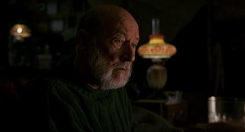 Movie still from “Halloween: The Curse of Michael Myers” (1995), directed by Joe Chappelle – An old man with a beard and a green sweater; Close Up shot, Low angle