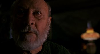 Movie still from “Halloween: The Curse of Michael Myers” (1995), directed by Joe Chappelle – An older man with a beard and a mustache; Close Up shot, Low angle