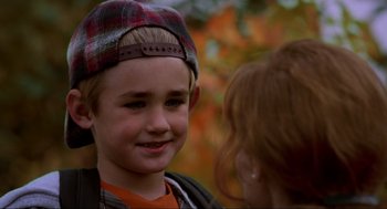 Movie still from “Halloween: The Curse of Michael Myers” (1995), directed by Joe Chappelle – A young person wearing a hat; Close Up shot, Over the shoulder angle